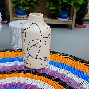 Vase with drawn modern faces